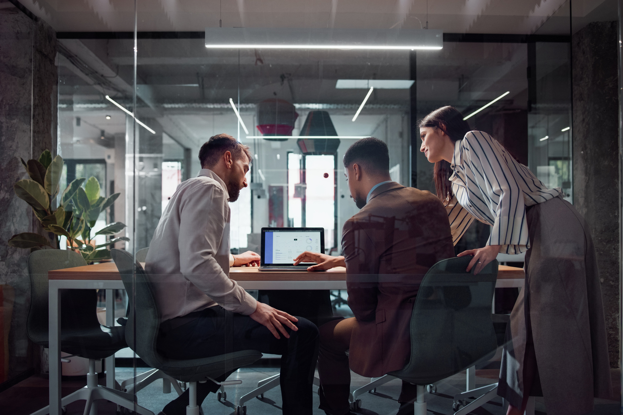 Team Collaboration in a Modern Office with Technical and Digital Discussions
