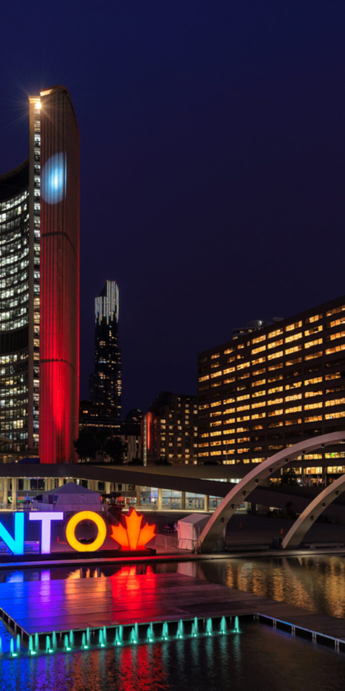 Toronto City Hall and Toronto Sign in downtown at night, in Toronto, Ontario, Canada