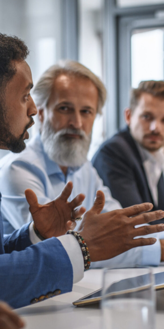 Executive Team Listening to Contrary Views from Colleague