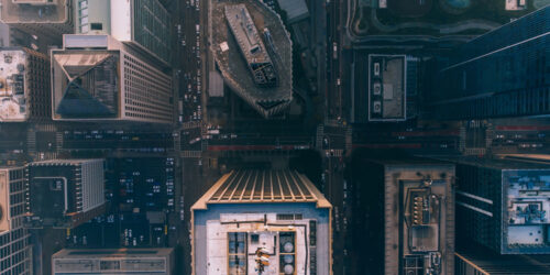 Drone view of modern business district with large buildings located near roads and park located in large city of San Francisco