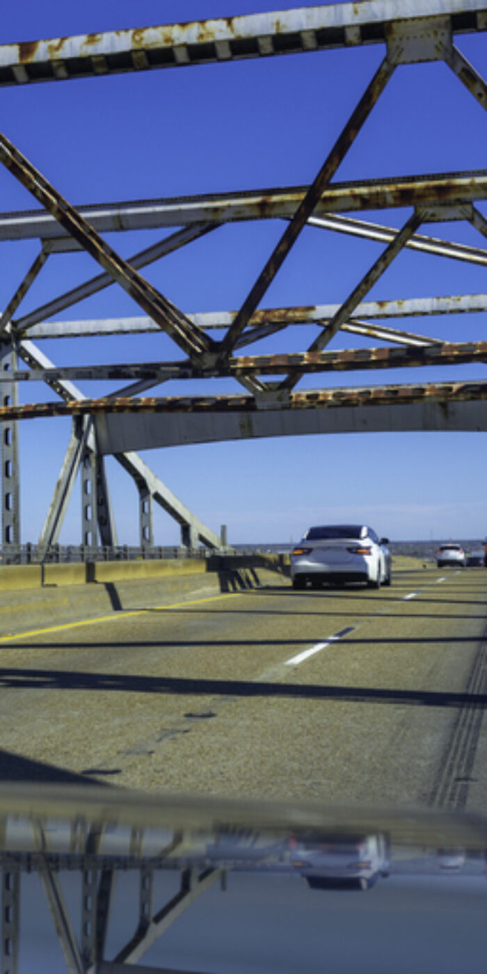 Calcasieu River Bridge, close-up abstract geometry with partial reflections on the car hood, near Lake Charles on Interstate 10 Highway over the Mississippi River in Louisiana, USA