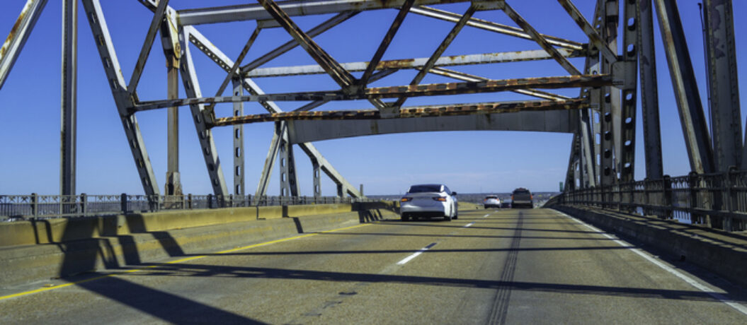 Calcasieu River Bridge, close-up abstract geometry with partial reflections on the car hood, near Lake Charles on Interstate 10 Highway over the Mississippi River in Louisiana, USA