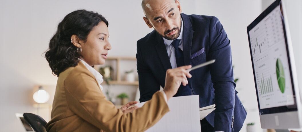Government leaders reviewing asset management data and capital planning charts