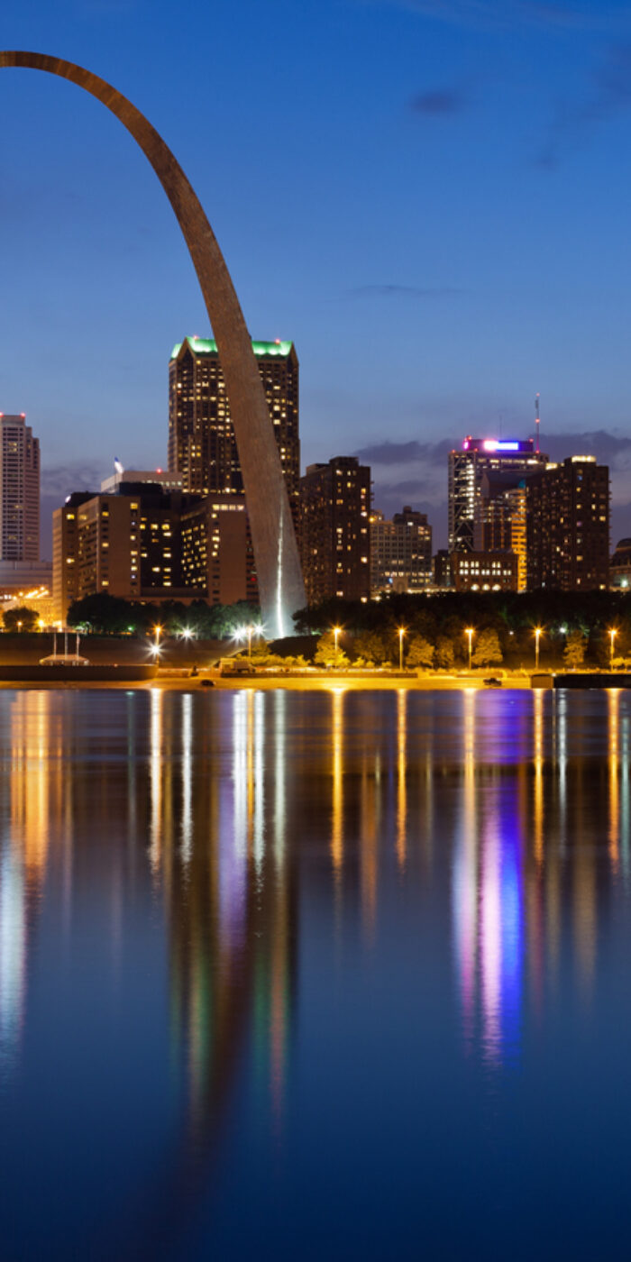 Image of St. Louis downtown with Gateway Arch at twilight.