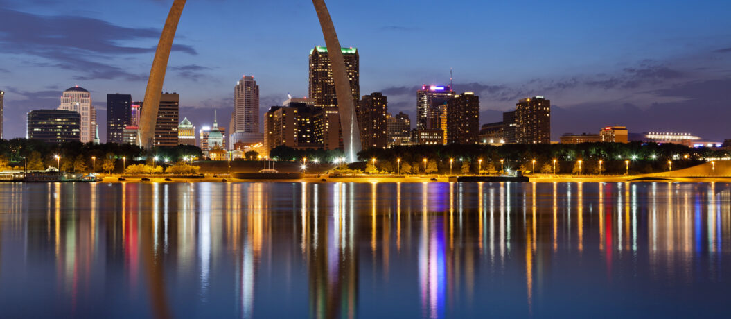 Image of St. Louis downtown with Gateway Arch at twilight.