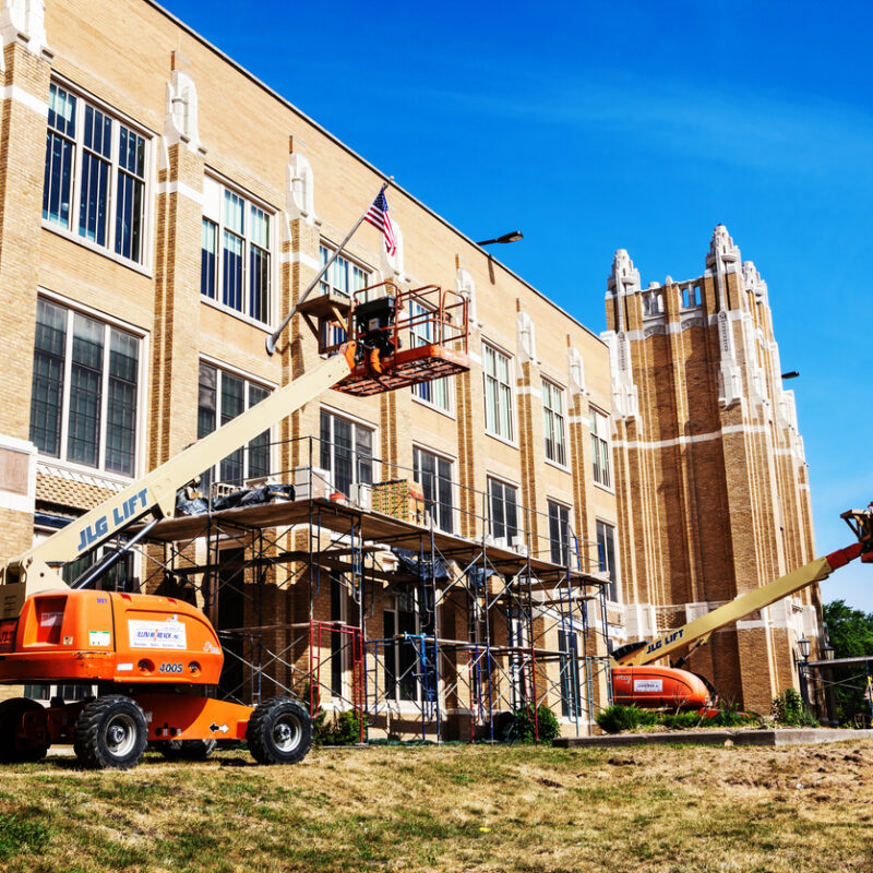 "Chicago, USA - July 22, 2012: Mount Vernon Elementary School being renovated in Washington Heights, a Chicago community on the Far Southwest Side. Construction equipment. No people."