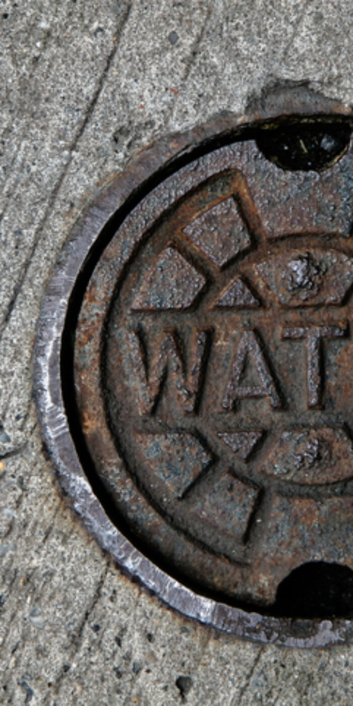 A water main manhole cover.