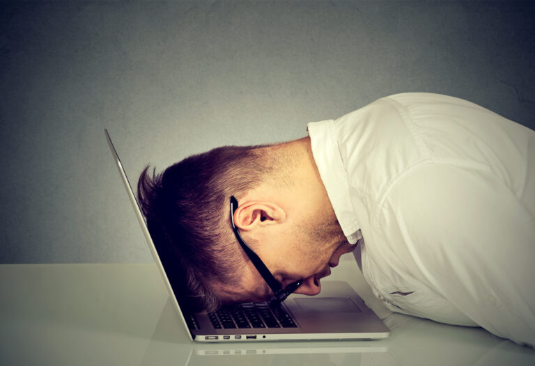 man upset at computer