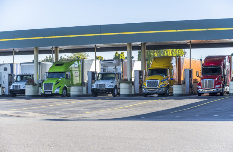 line of trucks pumping gas
