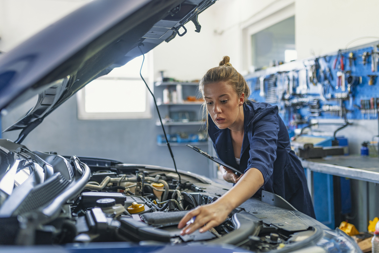 A fleet technician performs preventive maintenance.