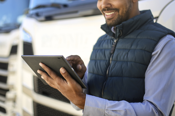Truck driver using a tablet
