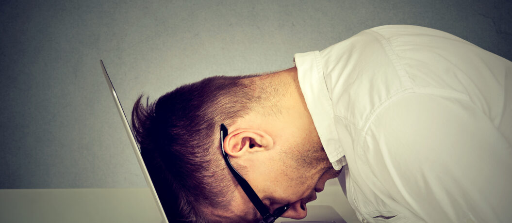 man upset at computer