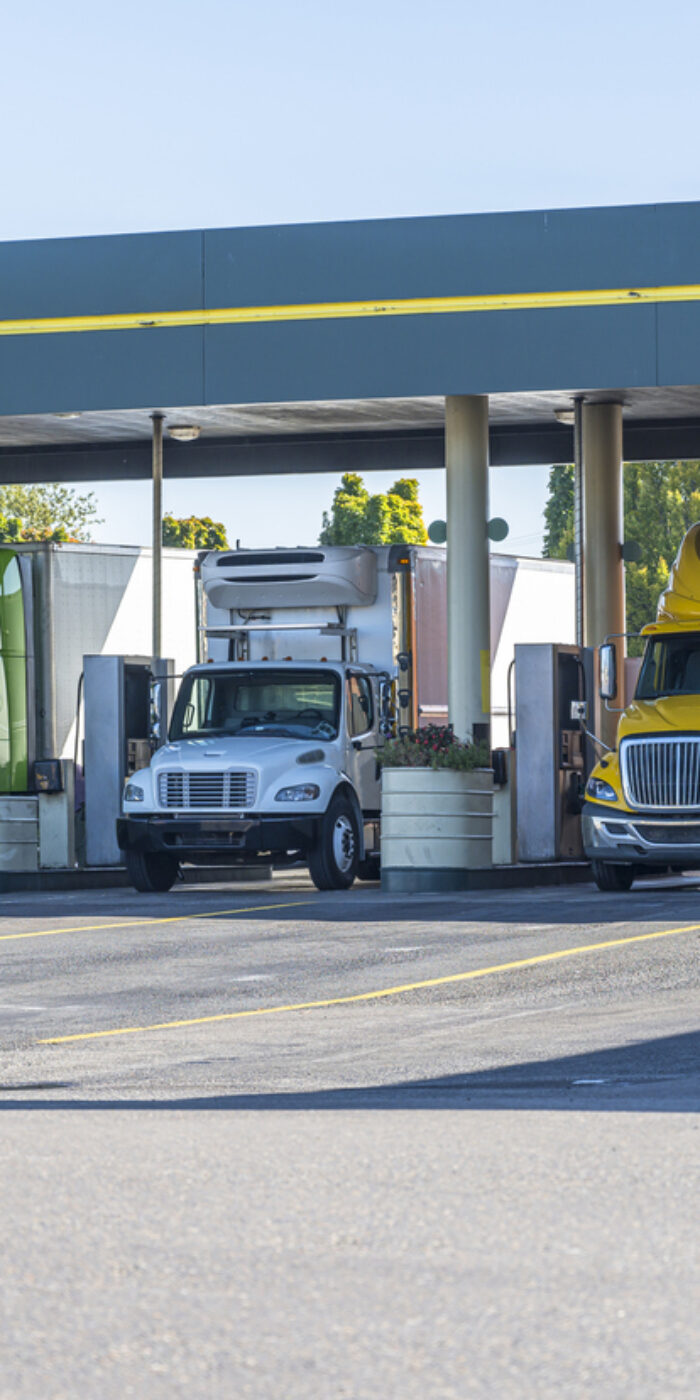 line of trucks pumping gas