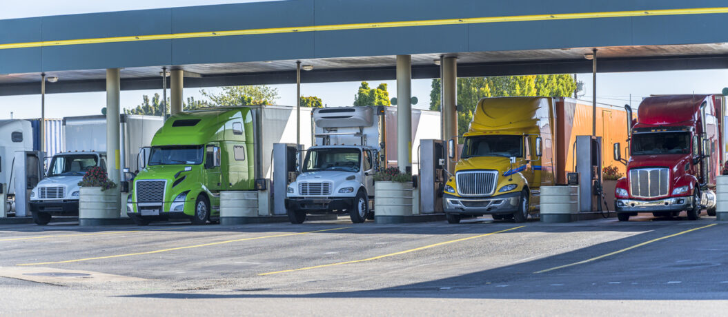 line of trucks pumping gas